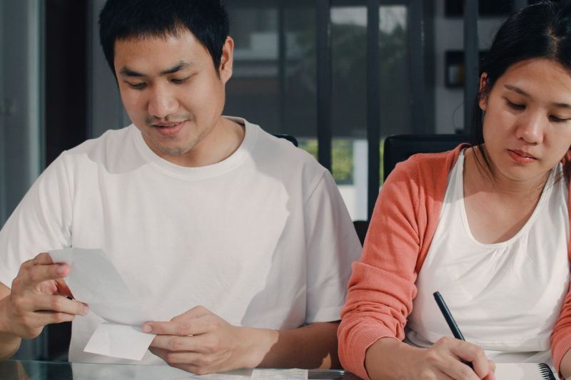 young-asian-pregnant-couple-records-income-expenses-home-mom-dad-happy-using-laptop-record-budget-tax-financial-document-e-commerce-working-living-room-home(1).jpg